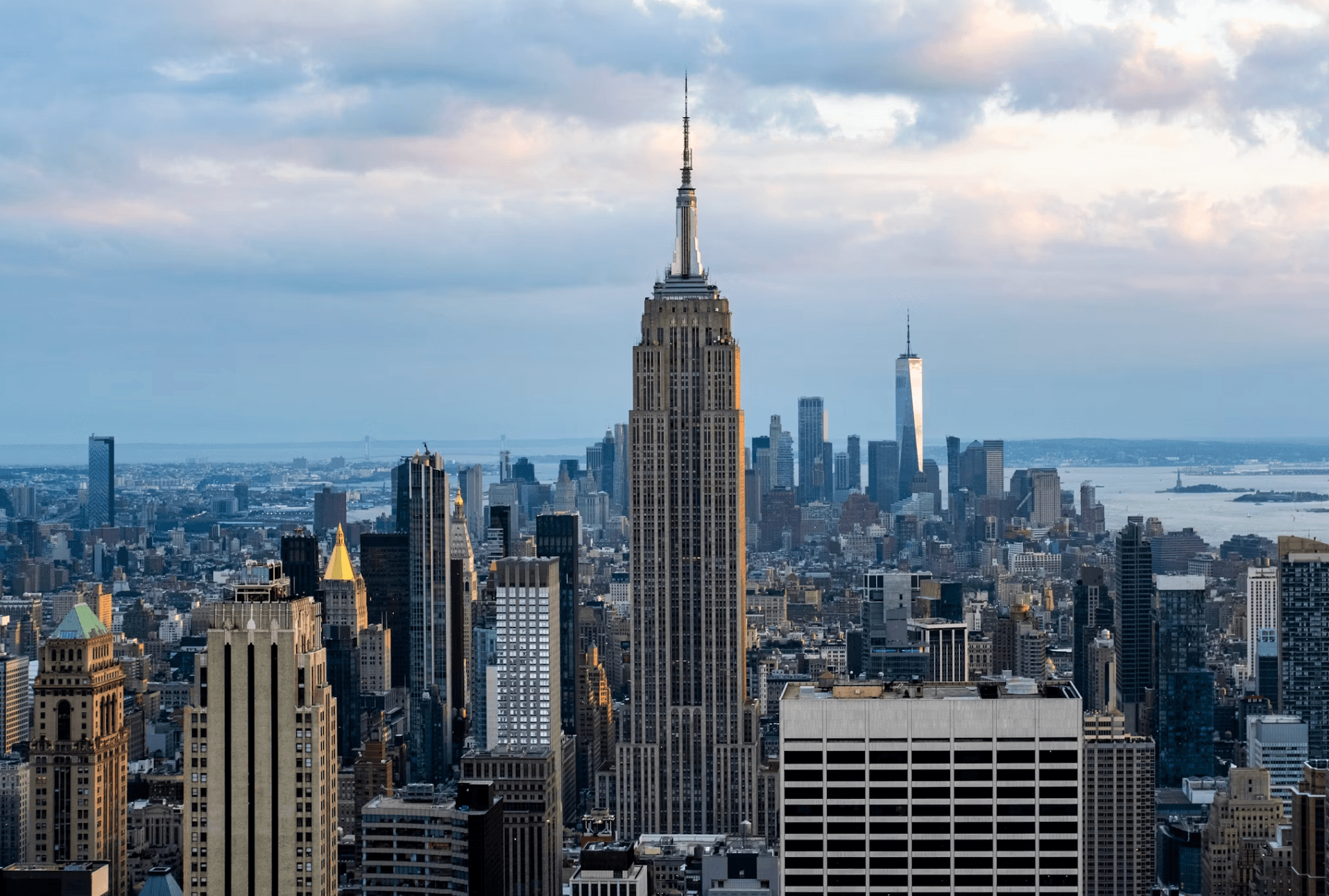 The Manhattan skyline at dusk, the Empire State Building at its centre