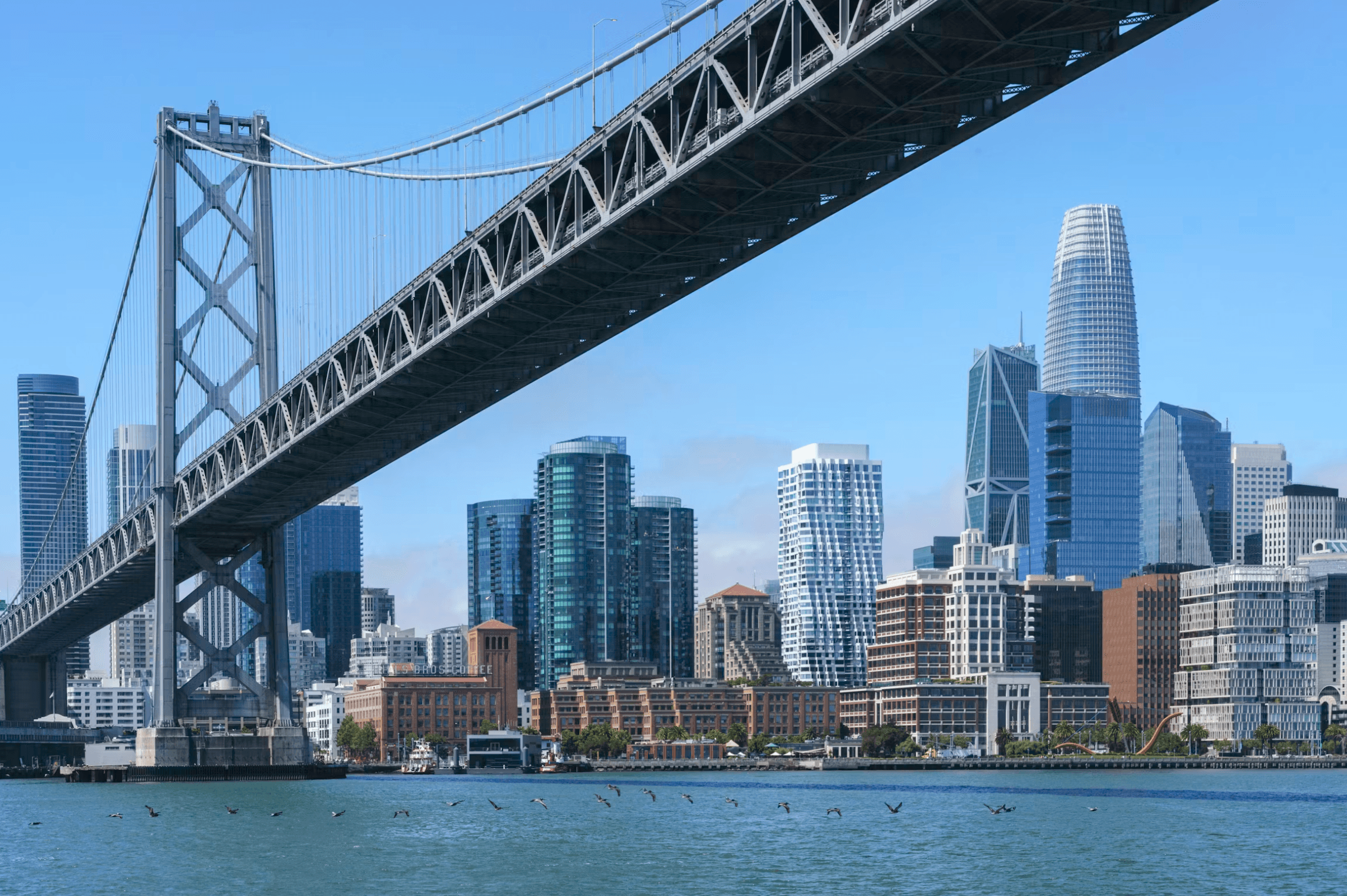The San Francisco skyline beneath the Bay Bridge
